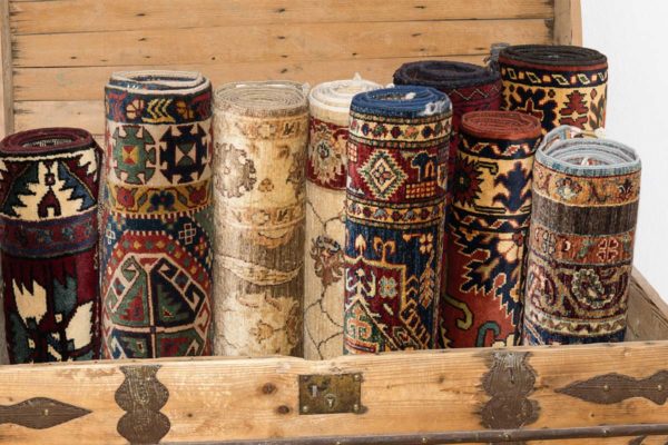 Wooden Chest Full Of Decorative Rugs